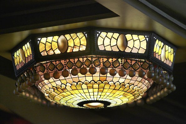 The Belasco Theater's ornate ceiling sconce lights.